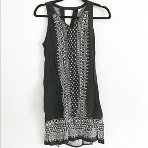 black sleeveless dress with white floral pattern